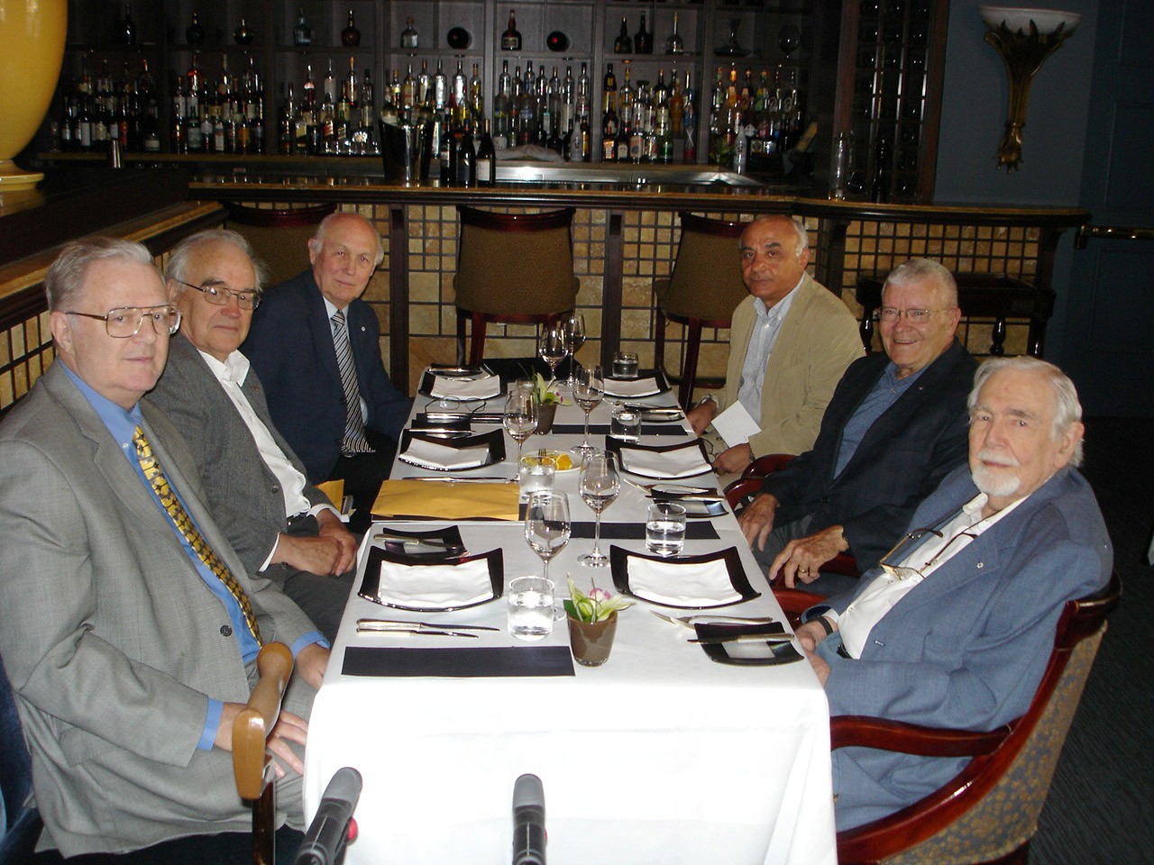 Five UTIAS Professors and astronaut Fred Haise at the dinner table