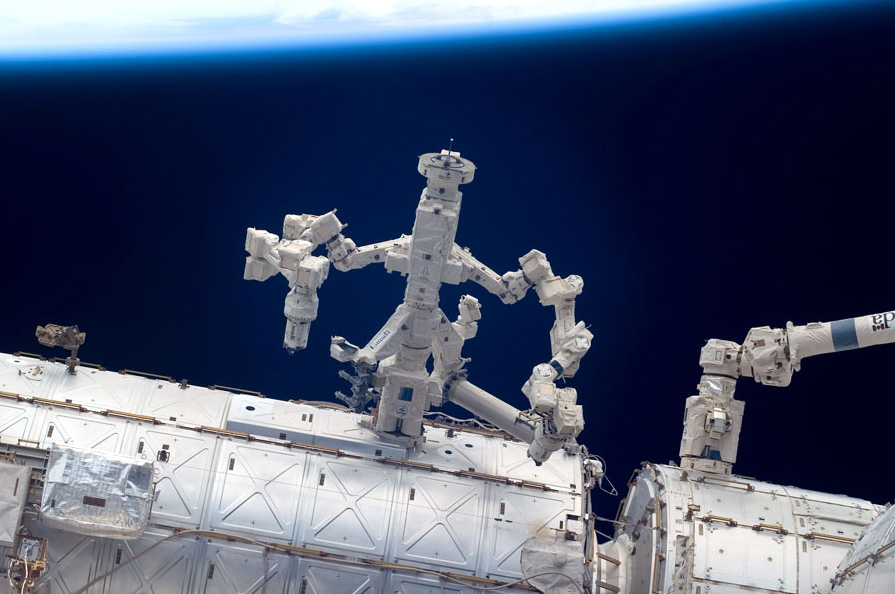 Exterior of the shuttle and Canadarm in outer space