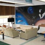 Cafeteria featuring a space mural, foozball table and seating