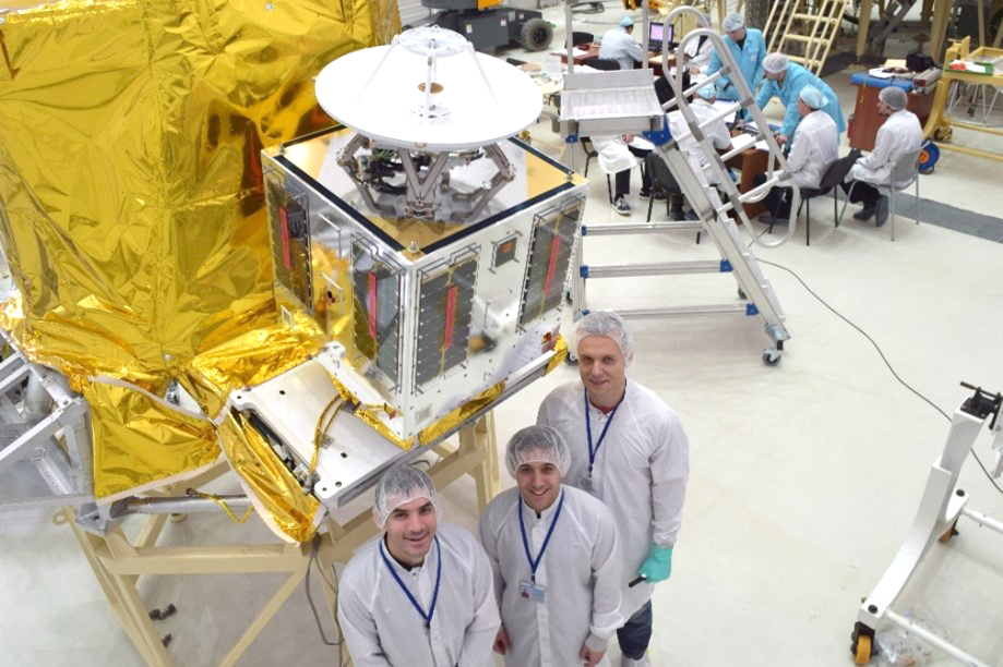Researchers in front of their equipment