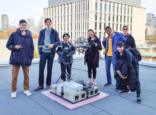 Members of the UTAT Space Systems division gather on the sixth-floor roof of the Bahen Centre with the fully assembled ground station